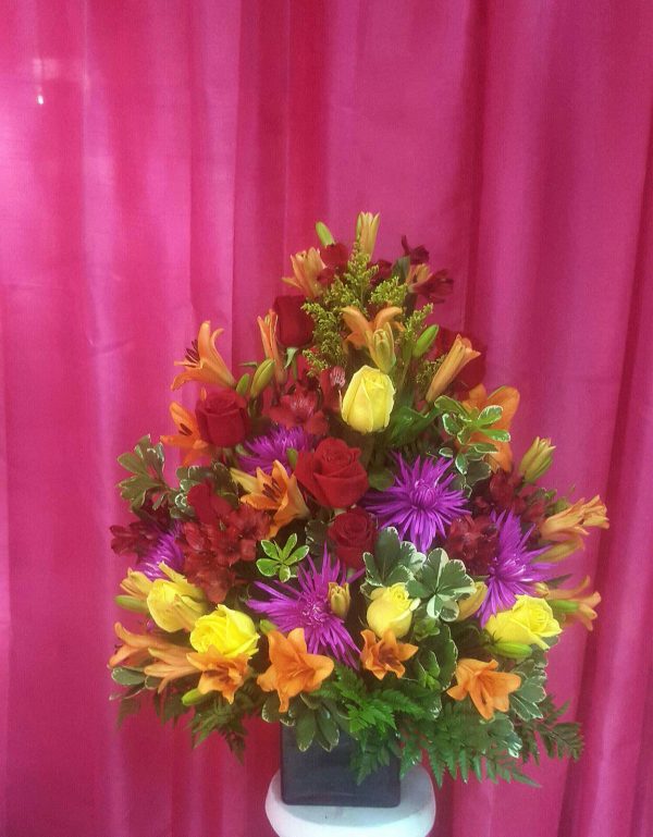 Tropical flowers in squared vase