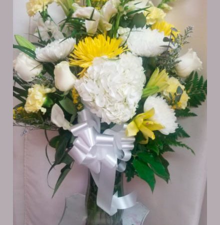 Condolence flowers. White and yellow.