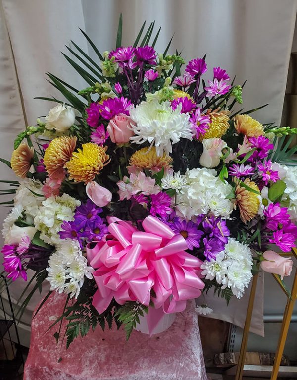 Multi shades of pink funeral basket