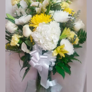 Condolence flowers. White and yellow.